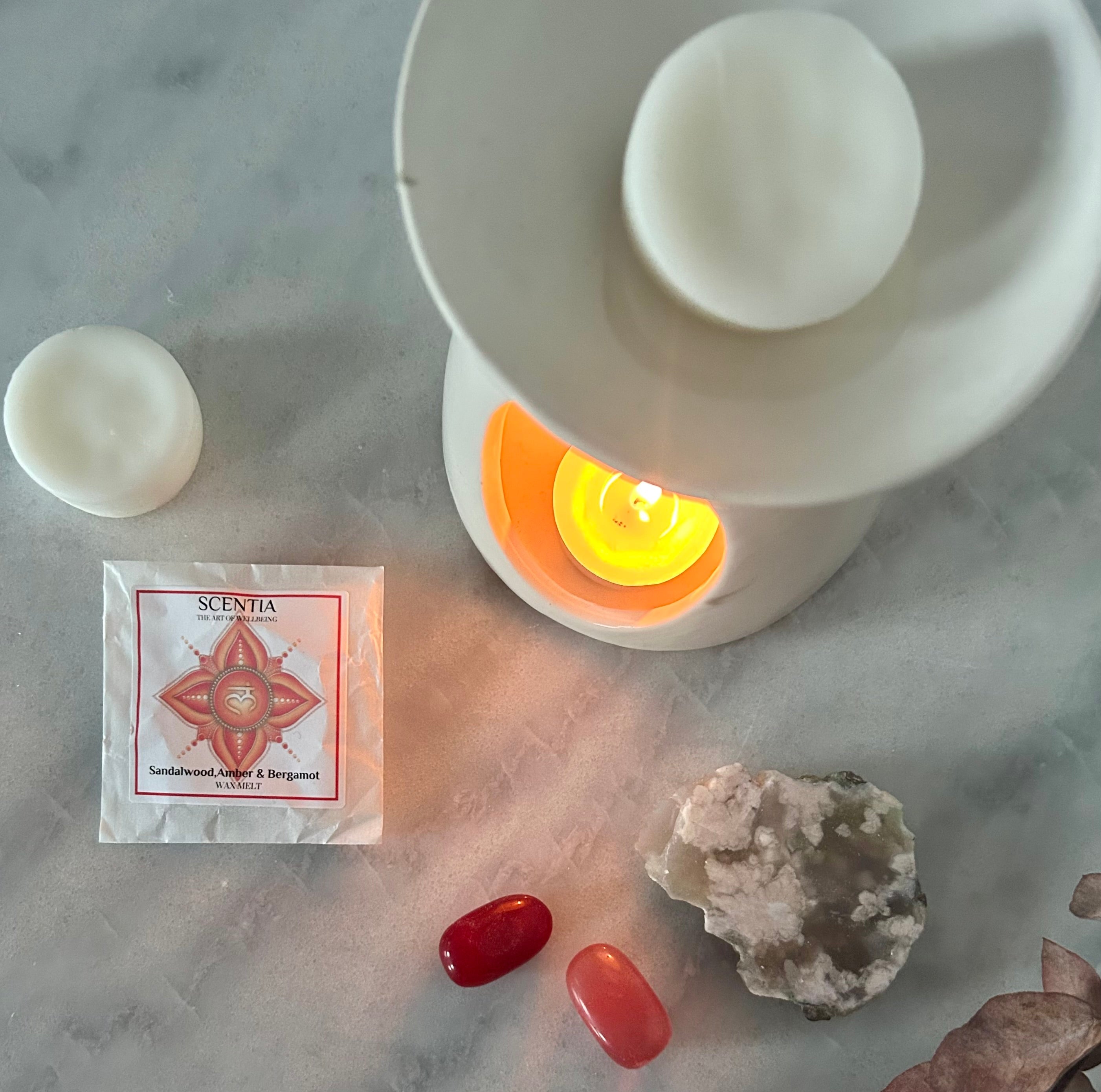 scentia wax melt in burner surrounded by crystals